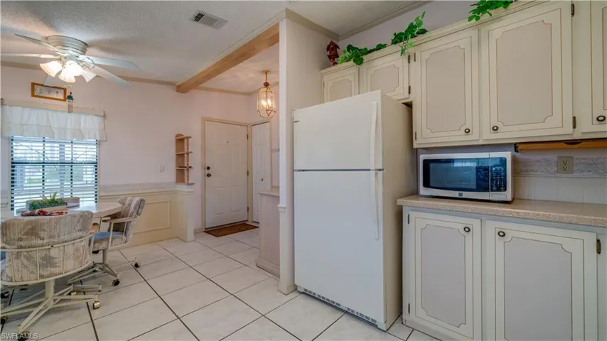 The kitchen, the heart of every home, just a few steps from the front door.