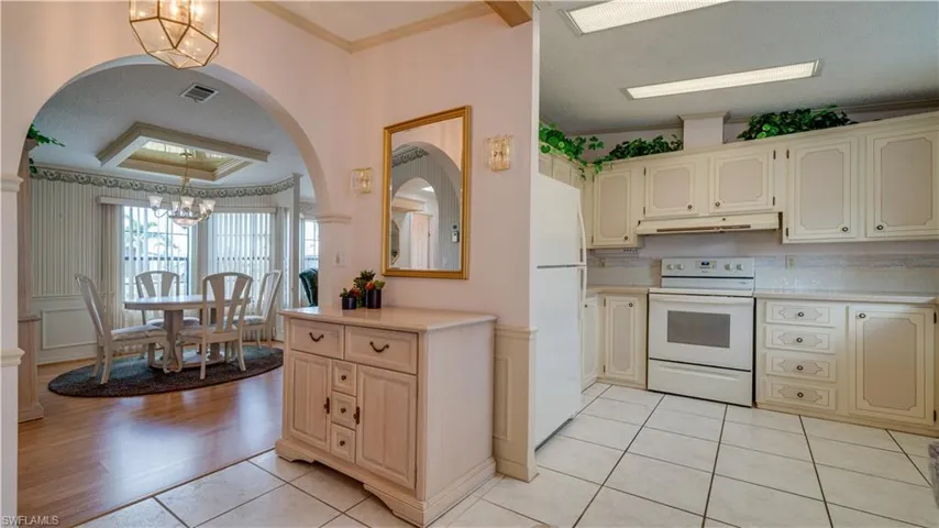 The large kitchen features so much cabinetry. Storage space abounds.