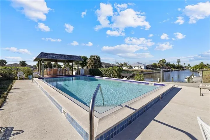 Community pool with a patio area
