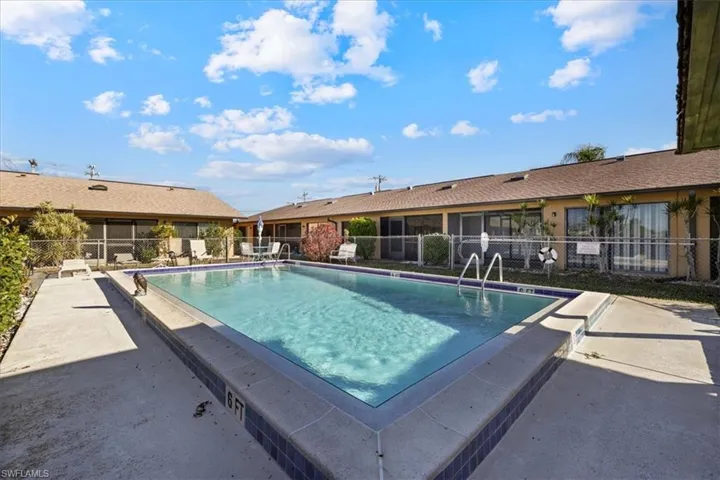 Community pool featuring a patio area