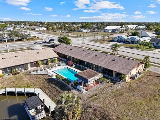 Aerial view of residential area featuring a pool area