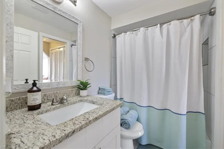 Bathroom featuring vanity and a shower with curtain