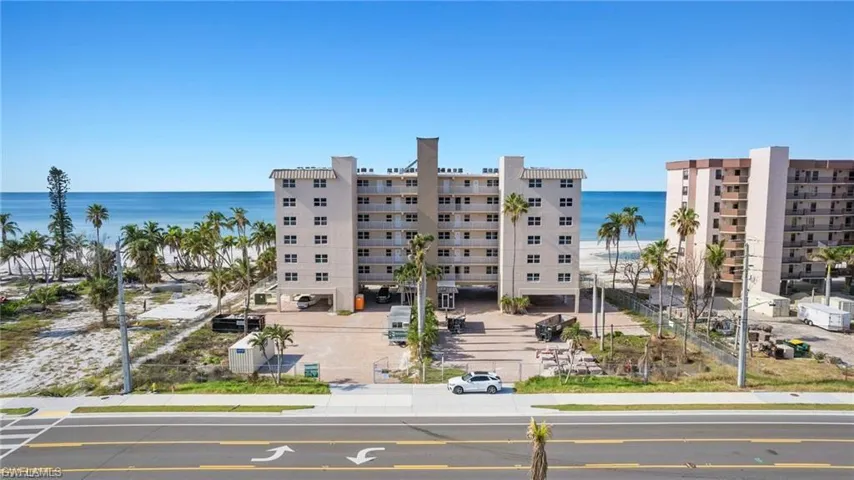 View of apartment building / complex featuring a water view