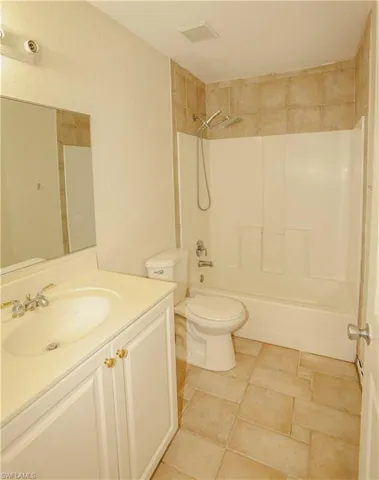 Bathroom with vanity and shower / bathtub combination