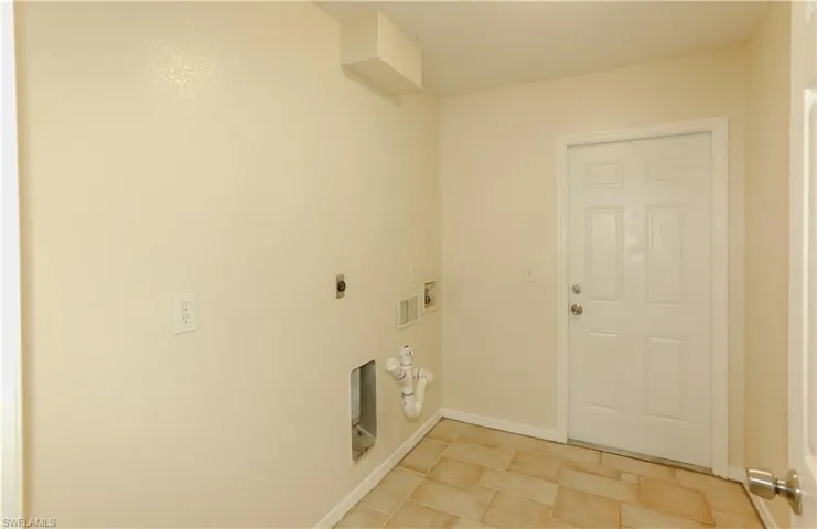 Laundry area featuring hookup for a washing machine and hookup for an electric dryer