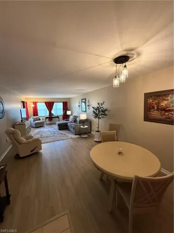 Dining area with baseboards and wood finished floors