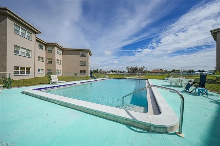 Community pool with a patio area