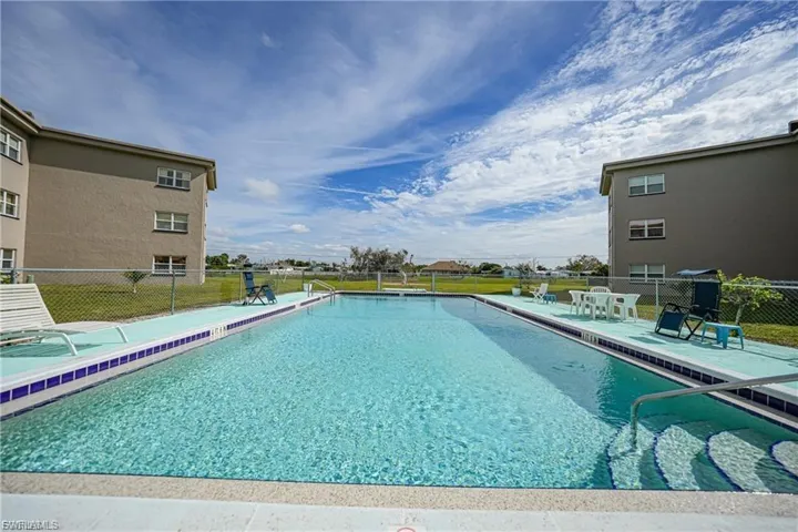 Community pool featuring a patio area