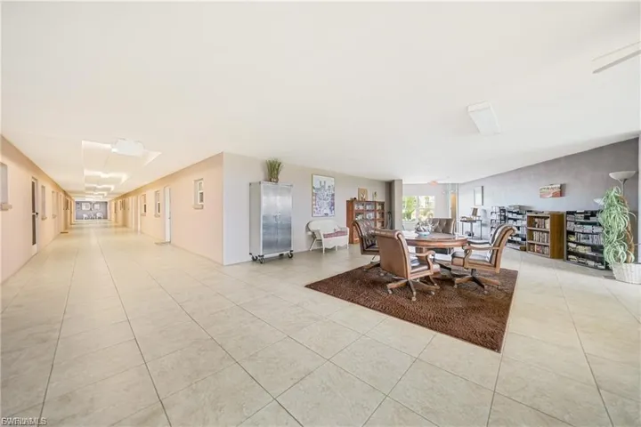 Dining space with light tile patterned floors