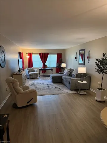 Living area featuring wood finished floors and baseboards