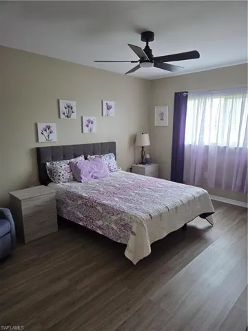 Bedroom featuring wood finished floors and ceiling fan