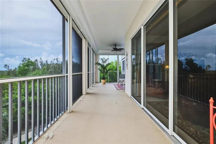 Balcony featuring a ceiling fan