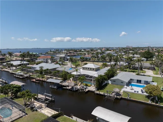 Drone / aerial view featuring a residential view and a water view