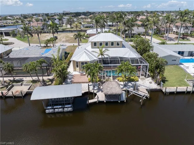 Drone / aerial view featuring a water view and a residential view