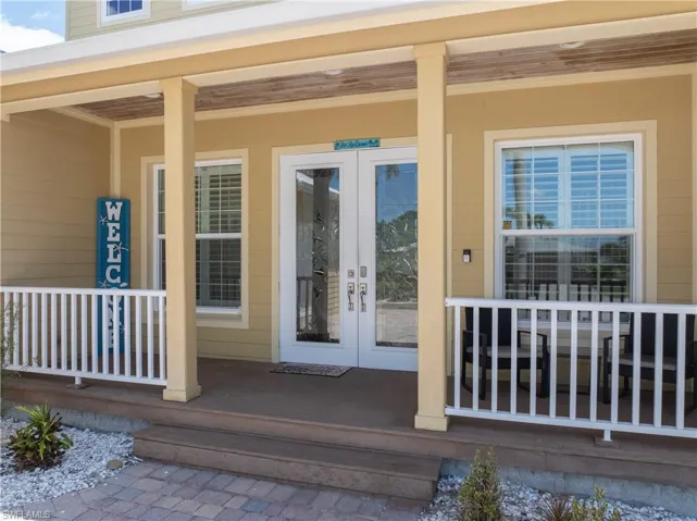 Property entrance featuring covered porch