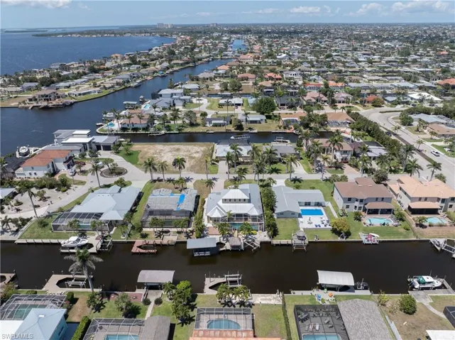 Bird's eye view with a water view and a residential view