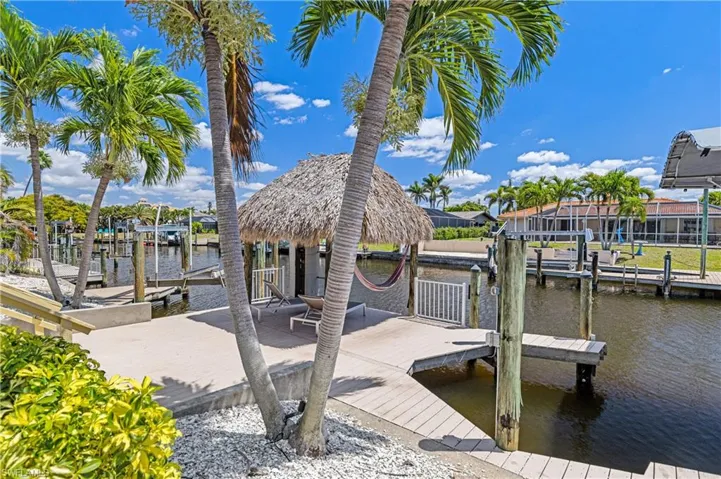 View of dock with a water view and boat lift