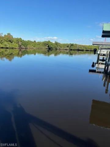 Dock area featuring a water view