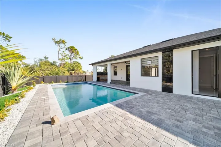 View of pool featuring a patio and a fenced backyard