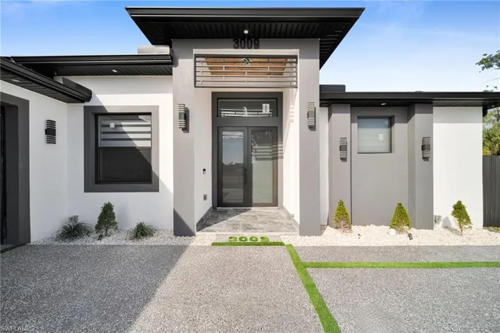 Doorway to property with stucco siding