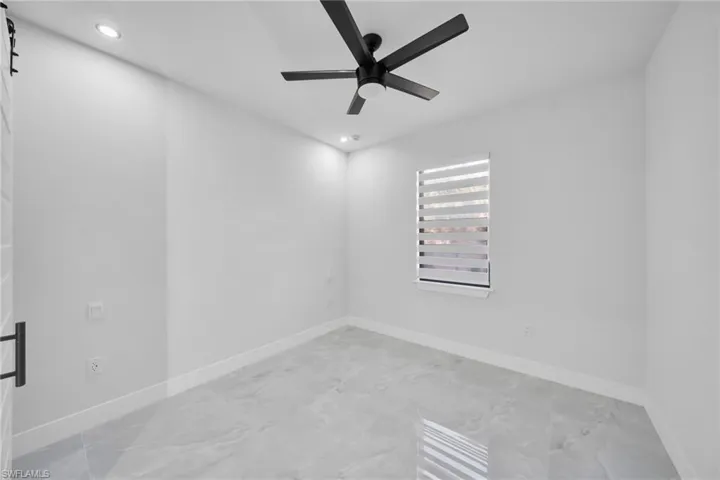 Unfurnished room with a ceiling fan and recessed lighting