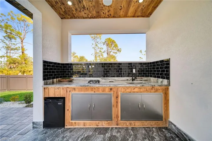 View of patio with an outdoor kitchen