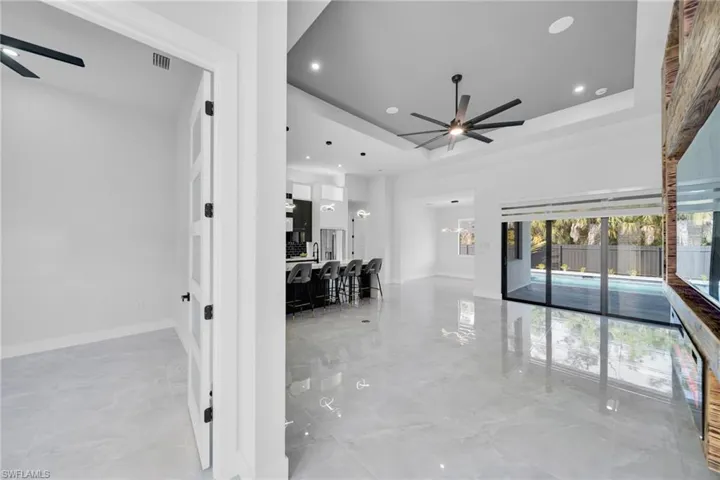 Hallway featuring baseboards and recessed lighting