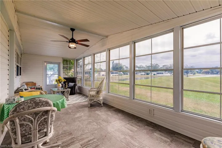 Sunroom / solarium featuring ceiling fan and lofted ceiling