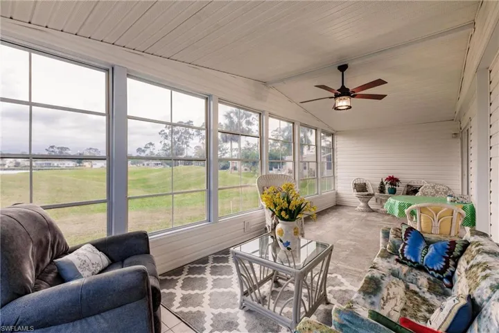 Sunroom featuring ceiling fan and lofted ceiling