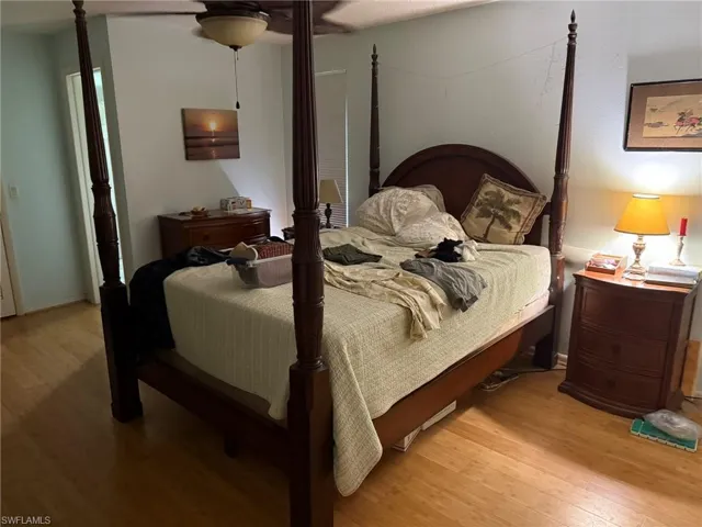 Bedroom featuring light wood finished floors and a ceiling fan
