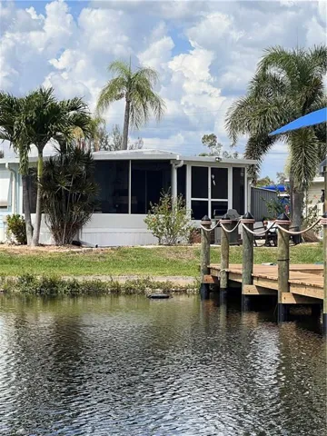 Rear of home showing porch and dock