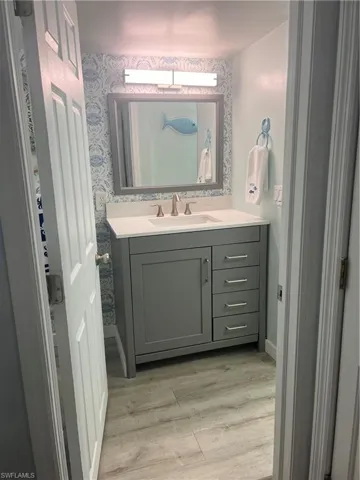 Guest bathroom with vanity and laminate flooring