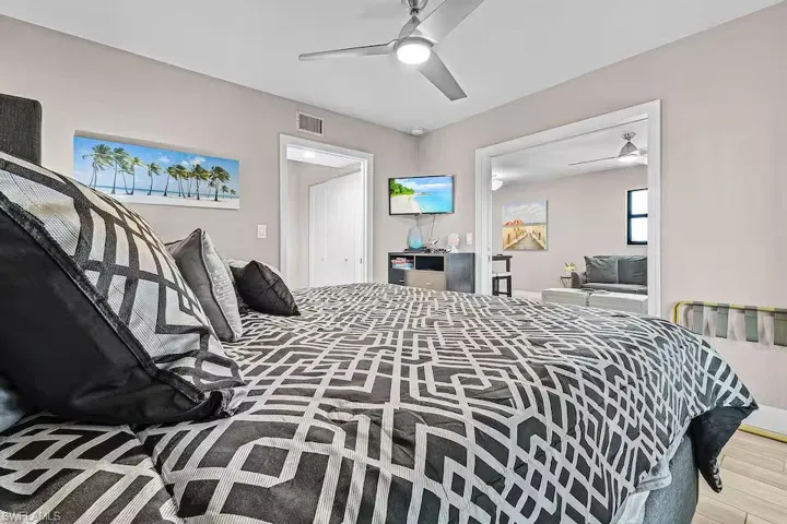 Bedroom featuring a ceiling fan and light-toned walls