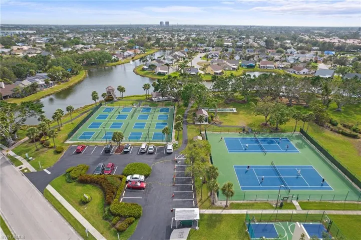 Aerial perspective of suburban area with a large body of water