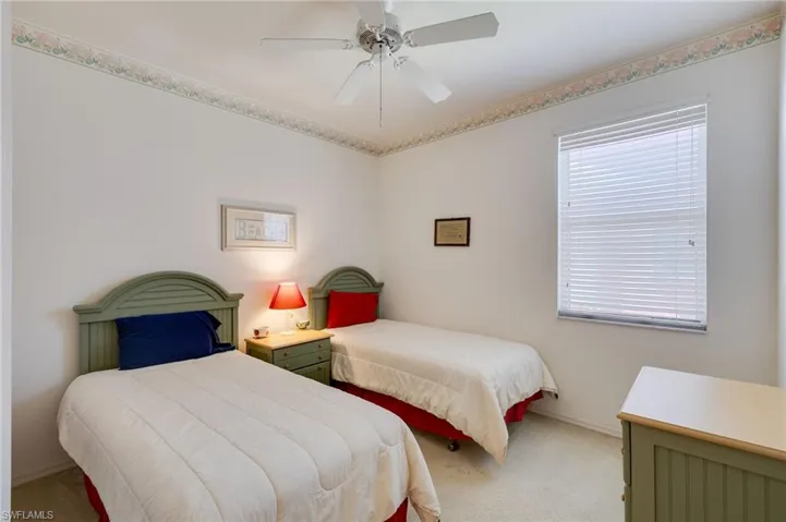 Bedroom featuring carpet and ceiling fan