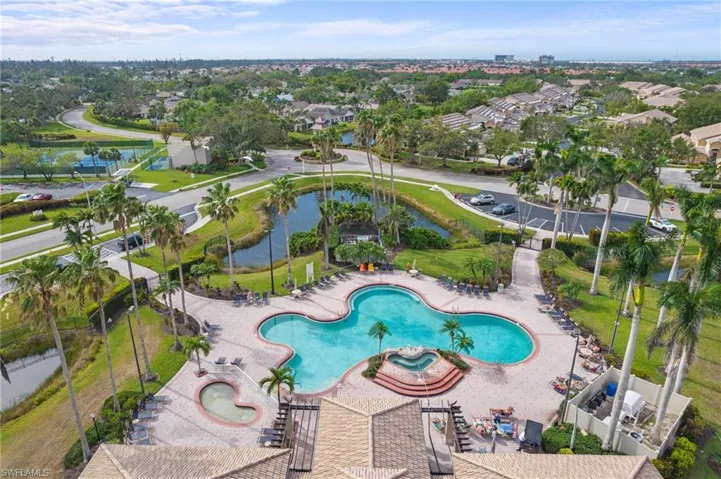 Community pool with a patio area