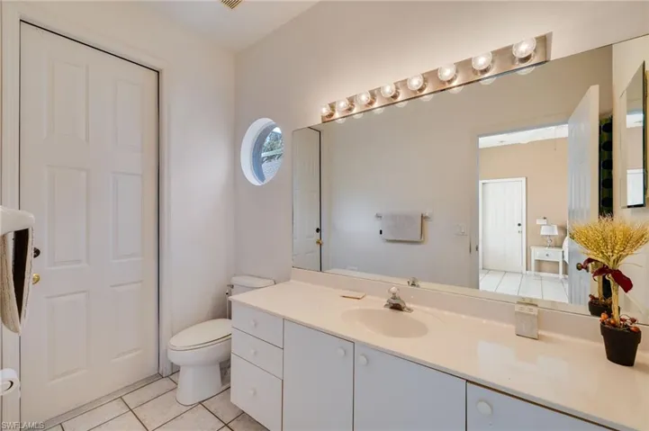 Bathroom featuring vanity and light tile patterned floors