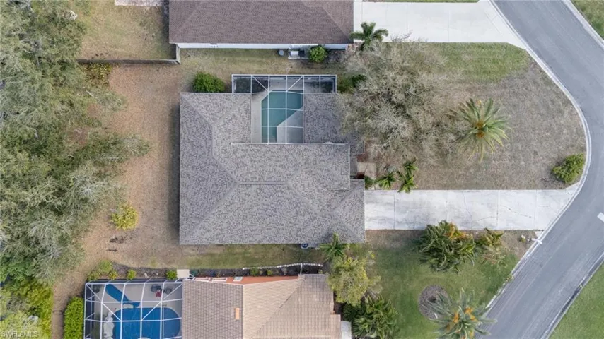 View of subject property with a pool