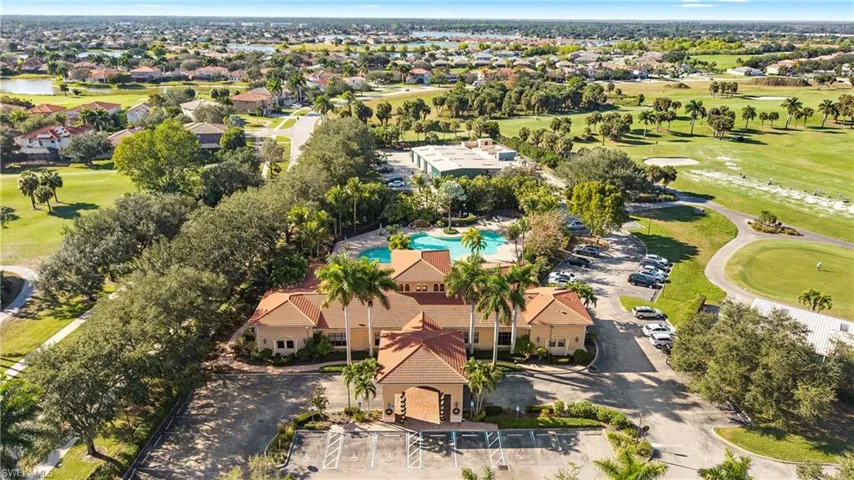 Aerial view of residential area featuring a golf club