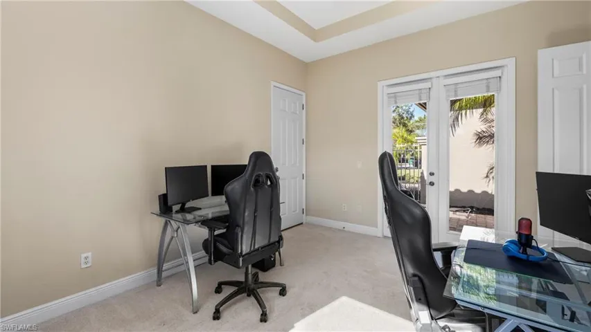 Office space featuring light colored carpet