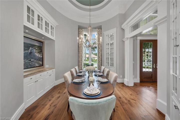 The dining room is so unique with beautiful inlaid cabinetry, quartzite serving area, and is the perfect place for your family get togethers!