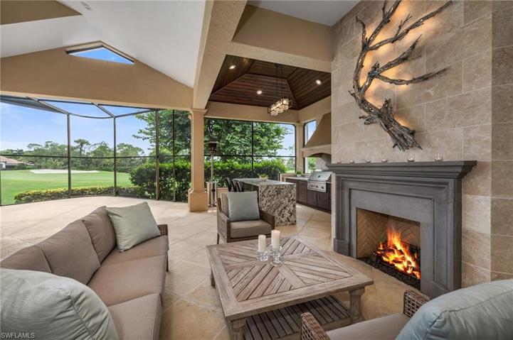 This cozy fireplace lounge area was added by its current owners, with a unique driftwood-inspired, custom light fixture over the mantle.  Wait until you see it at night!