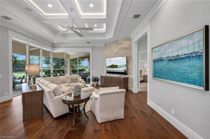 The family room sliding glass doors pocket back to bring in the outdoors.  The ceiling details add such ambient light to the room, that it will become your favorite room!