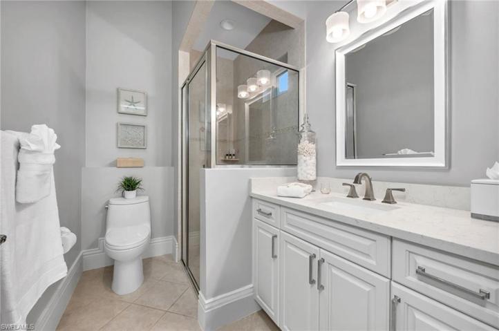 The guest bath has a chic, new image with updated cabinetry, quartz counters, new fixtures, and a Toto toilet, making it so comfortable, your guests will never want to leave.