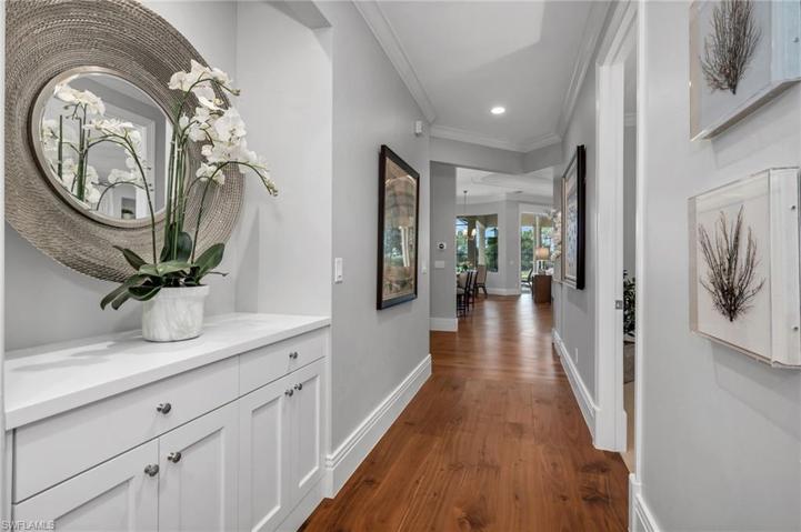 The hallway leading from the garage to the main living area, has two, ensuite bedrooms off to the right.
