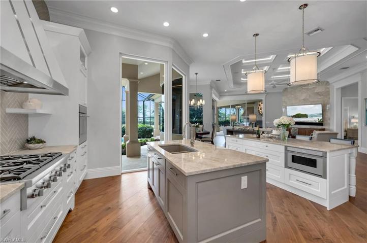 You have just entered your dream kitchen!  High-end appliances, plenty of storage, Taj Mahal quartzite on the two islands...