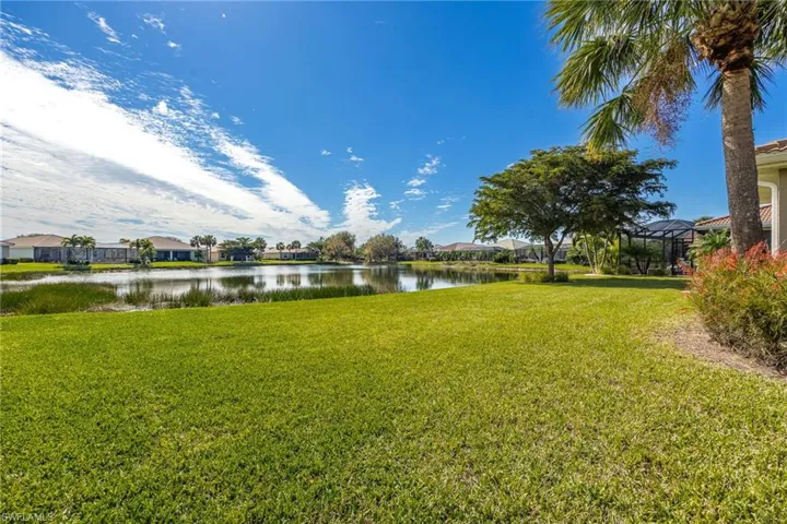 View of backyard with a water view