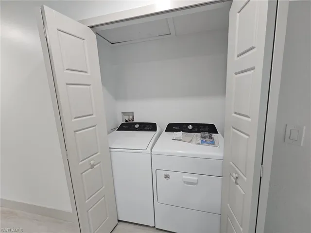 Laundry room with washing machine and dryer