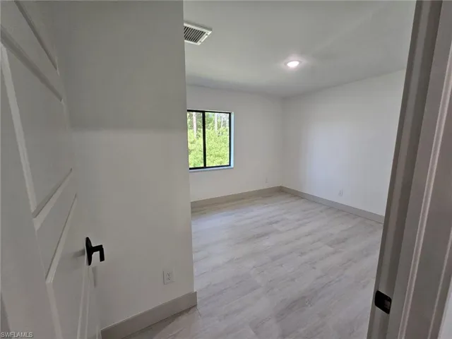 Unfurnished room featuring light wood-style flooring and recessed lighting