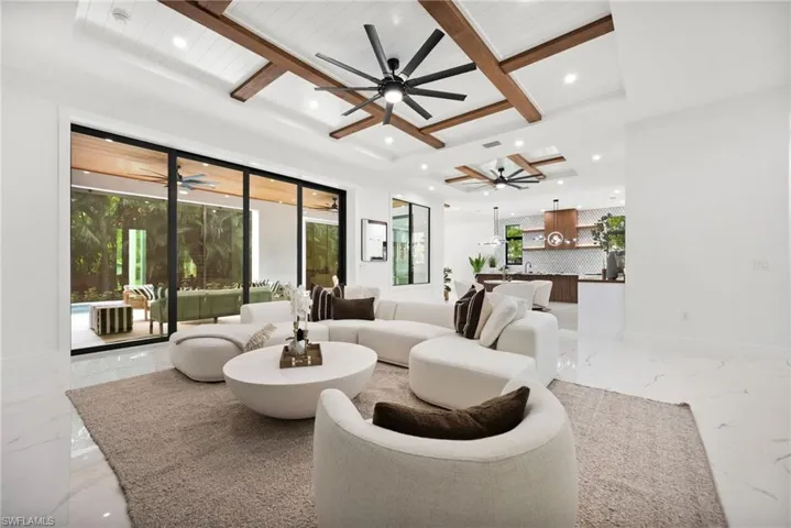 Fully pocketing sliding glass doors create a seamless indoor-outdoor living experience.